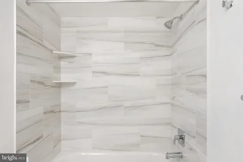 a view of balcony with wooden floor and fence