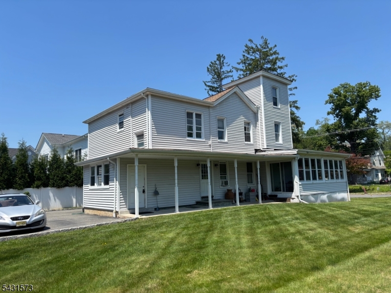 358 Woodland Road, Unit 2 Madison, NJ 07940 - Photo 3 of 50 a front view of a house with a garden