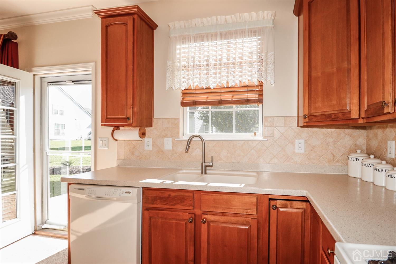 8 Pebble Creek Road Dayton, NJ 08810 - Photo 5 of 19 a kitchen with stainless steel appliances a sink and a window