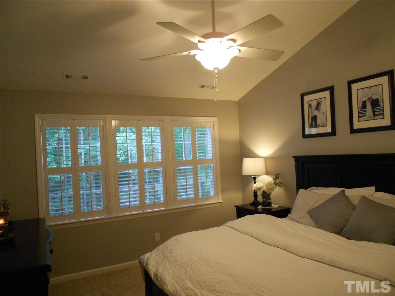 1601 Harvey Johnson Road Raleigh, NC 27603 - Photo 13 of 25 A huge master bedroom with ceiling fan and lots of natural light. Walk in master closet.