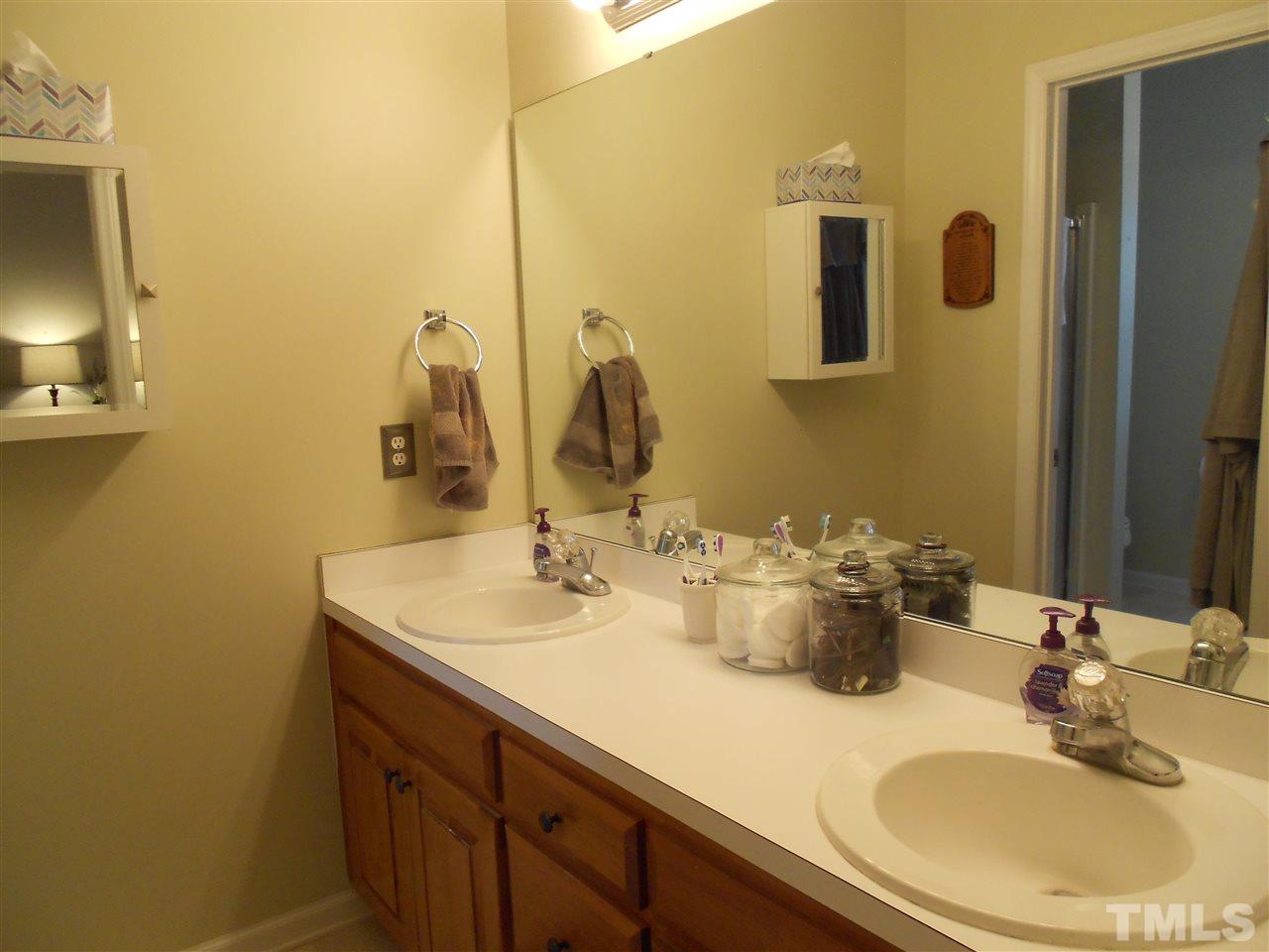 1601 Harvey Johnson Road Raleigh, NC 27603 - Photo 15 of 25 Double sink master Bath, separate area for tub and shower.
