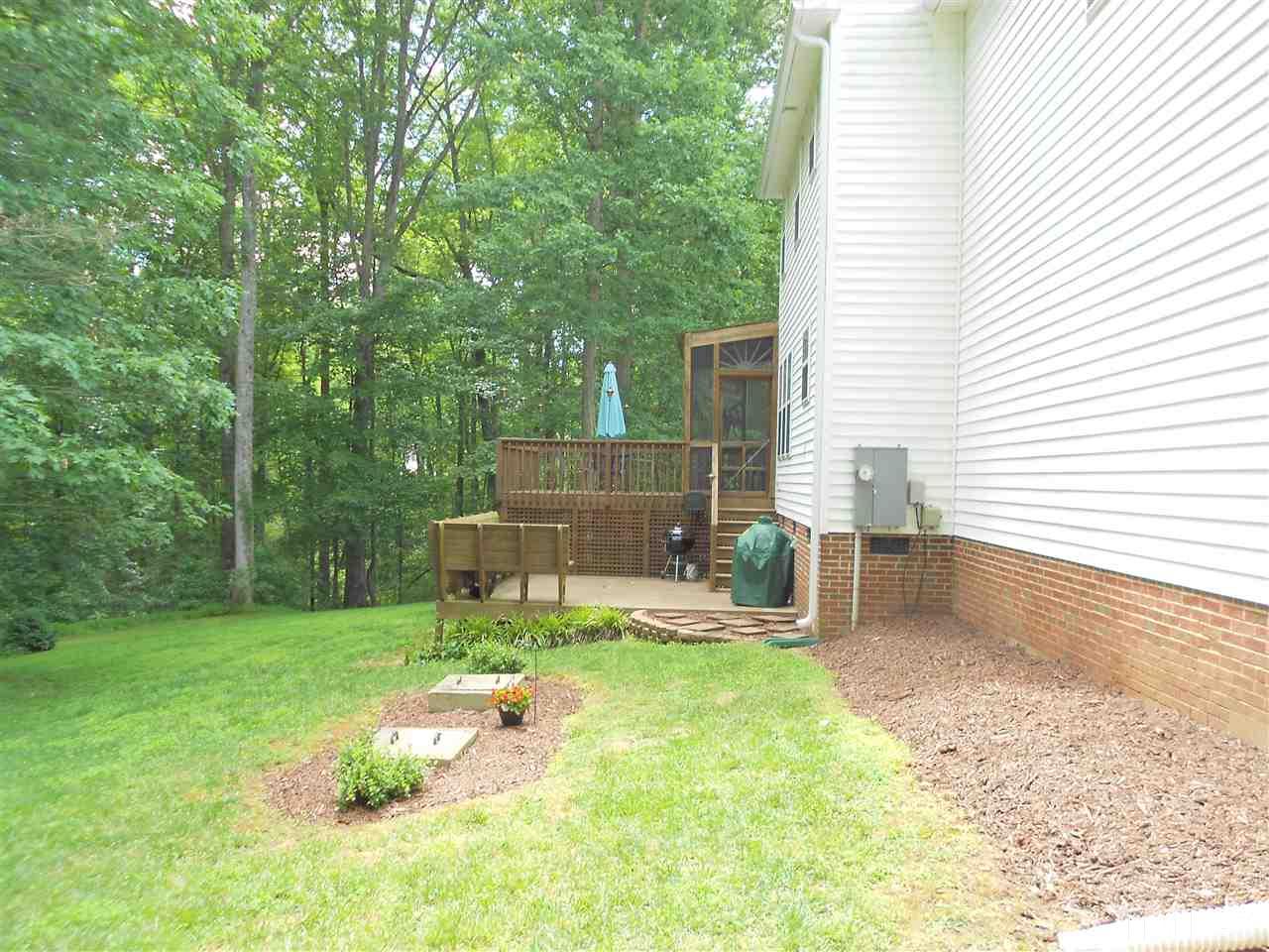1601 Harvey Johnson Road Raleigh, NC 27603 - Photo 20 of 25 Note the Screen Porch and TWO other decks all over looking the secluded back yard.