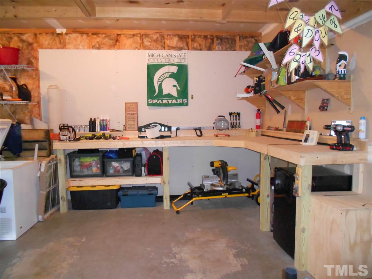 1601 Harvey Johnson Road Raleigh, NC 27603 - Photo 24 of 25 Built in area for a work shop in the garage.