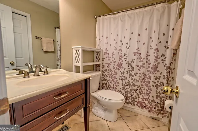 a kitchen with a sink appliances and cabinets