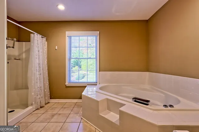 a bathroom with a sink a large mirror and a shower