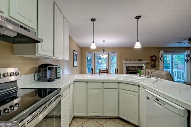 a kitchen that has a lot of cabinets in it