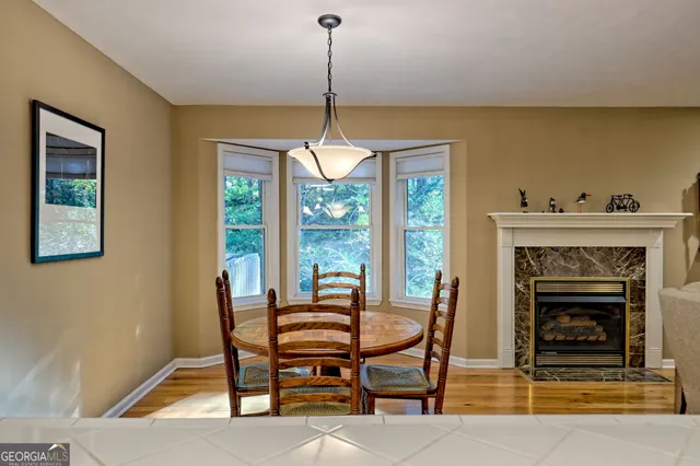 a living room with furniture a window and a fireplace