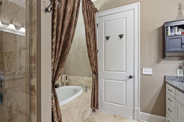 a bathroom with a tub sink and toilet