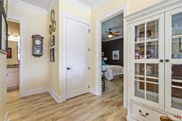 a view of a bedroom with wooden floor and closet