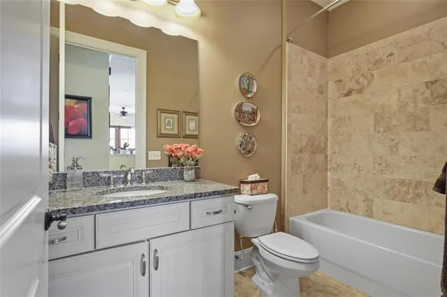 a bathroom with a sink a toilet and a bathtub