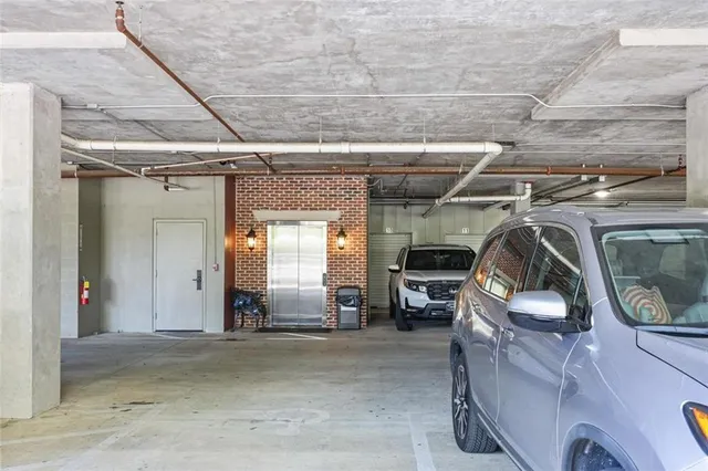 a view of garage with cars