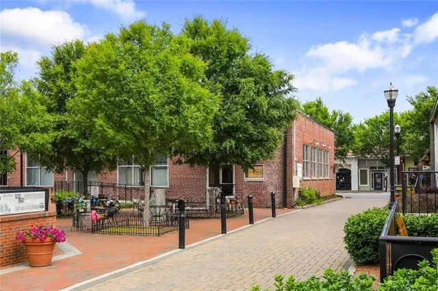a view of path along with retail shop and buildings