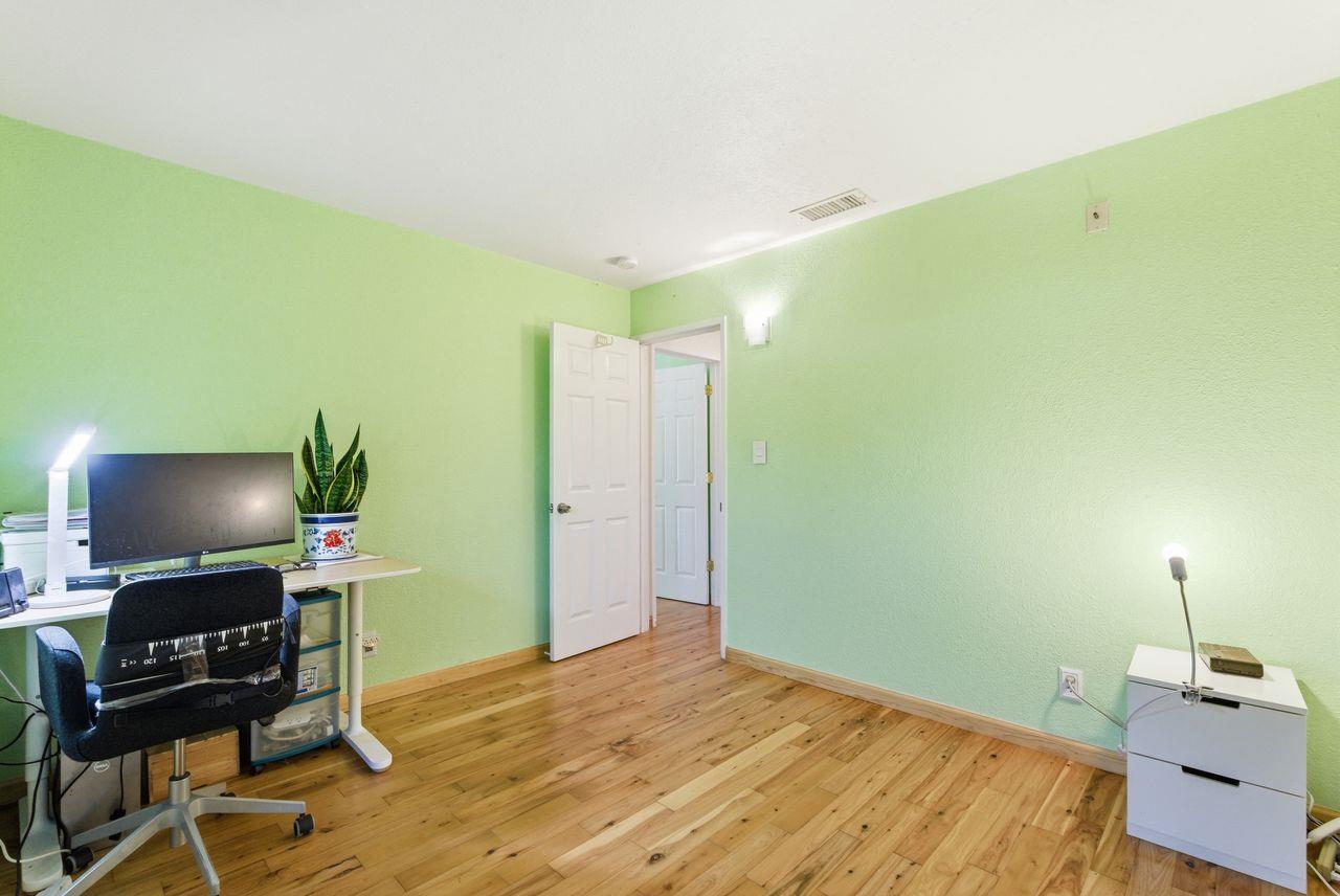5561 Roundtree Common Fremont, CA 94538 - Photo 11 of 29 a workspace with furniture and wooden floor