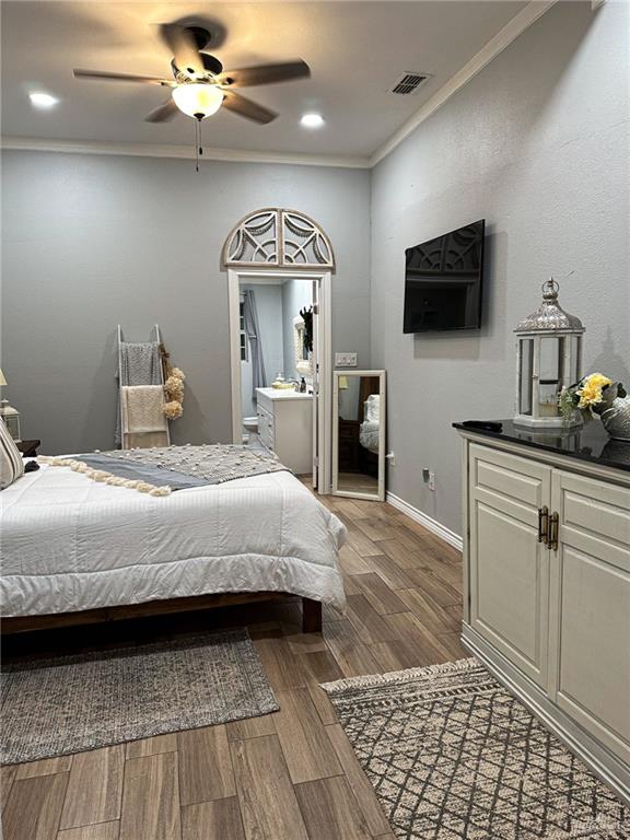 0 West Arroyo City Boulevard Rio Hondo, TX 78583 - Photo 13 of 29 a bedroom with a bed and a flat screen tv