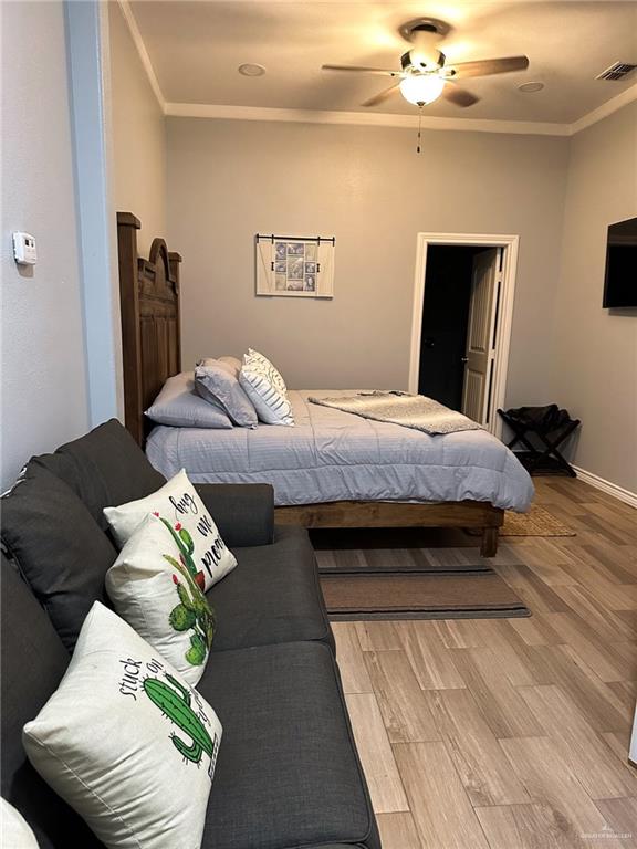 0 West Arroyo City Boulevard Rio Hondo, TX 78583 - Photo 14 of 29 a bedroom with bed and wooden floor