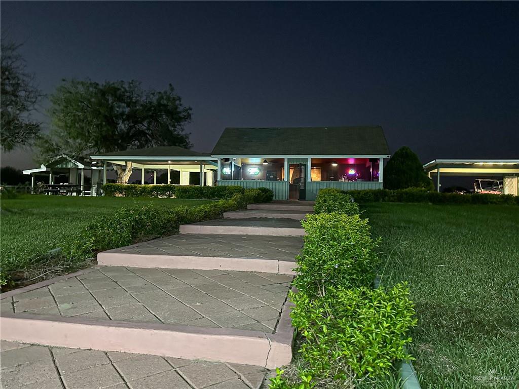 0 West Arroyo City Boulevard Rio Hondo, TX 78583 - Photo 3 of 29 a view of a house with a yard