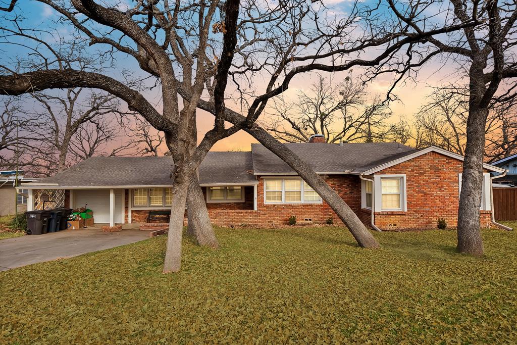 front view of a house with a yard