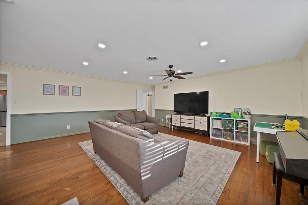 5705 Blue Ridge Drive Fort Worth, TX 76112 - Photo 14 of 40 a living room with furniture and a flat screen tv