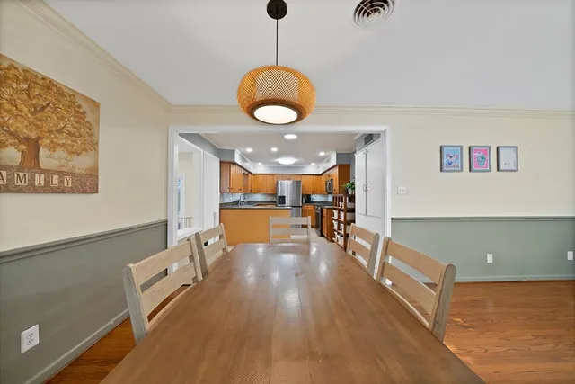 a view of kitchen and dining room with wooden floor
