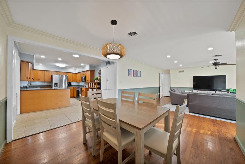 5705 Blue Ridge Drive Fort Worth, TX 76112 - Photo 20 of 40 a living room with furniture a flat screen tv and kitchen view