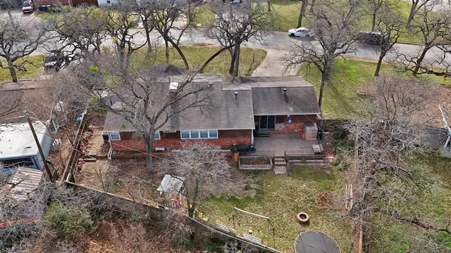 a aerial view of a house with garden space and sitting area