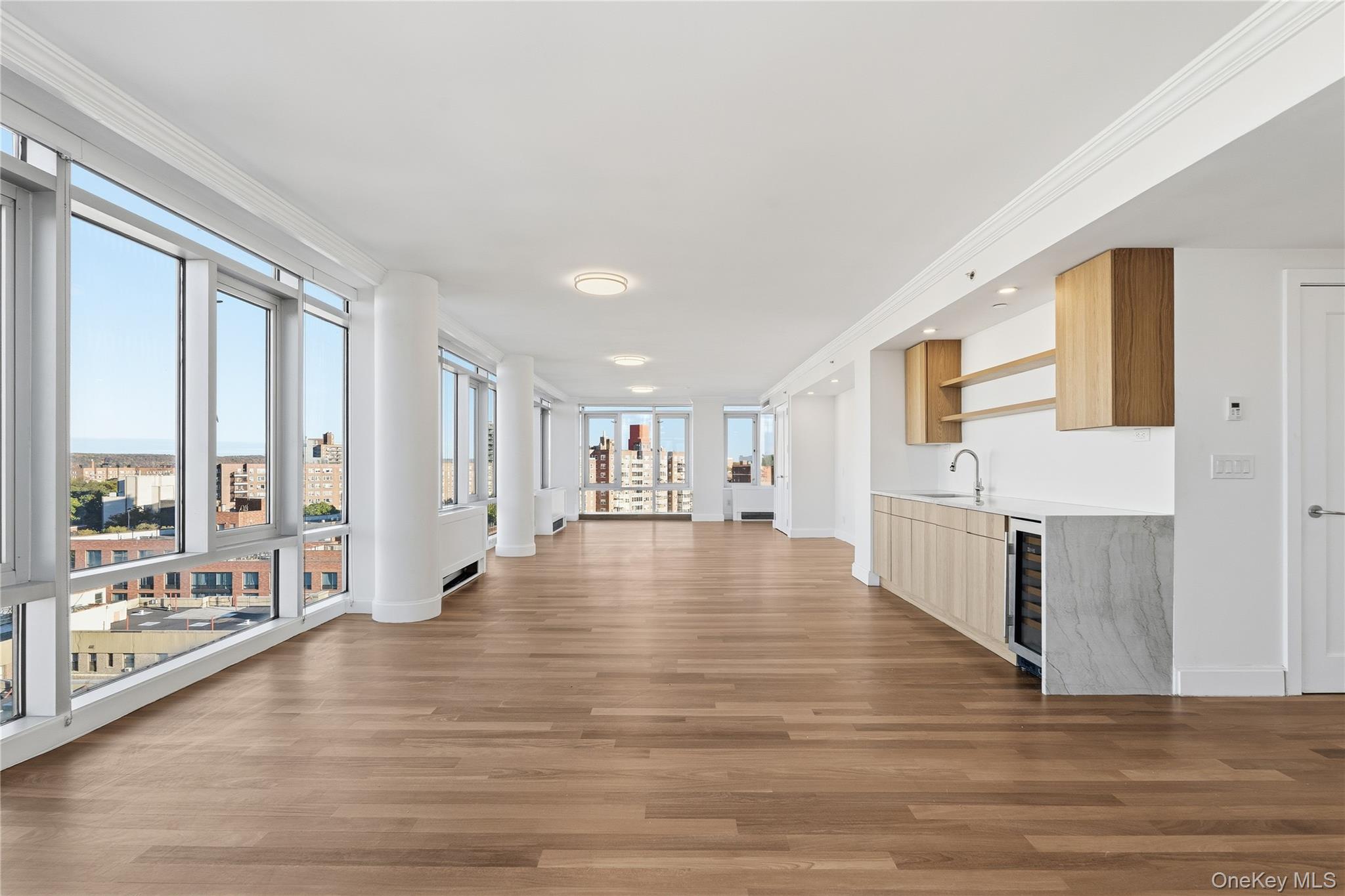 3220 Arlington Avenue, Unit 14AB Bronx, NY 10463 - Photo 1 of 1 a view of an empty room with window and wooden floor