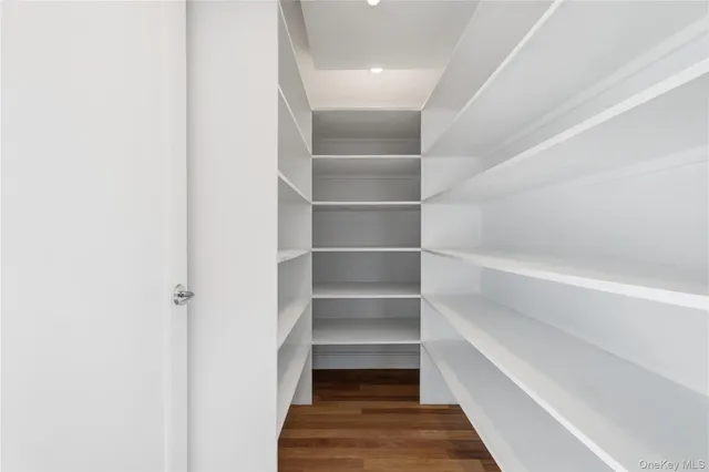 a view of a hallway with washer and dryer