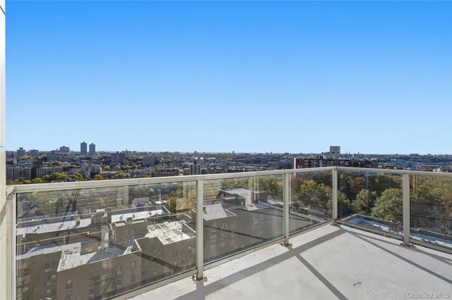 a view of a porch with a table and chairs