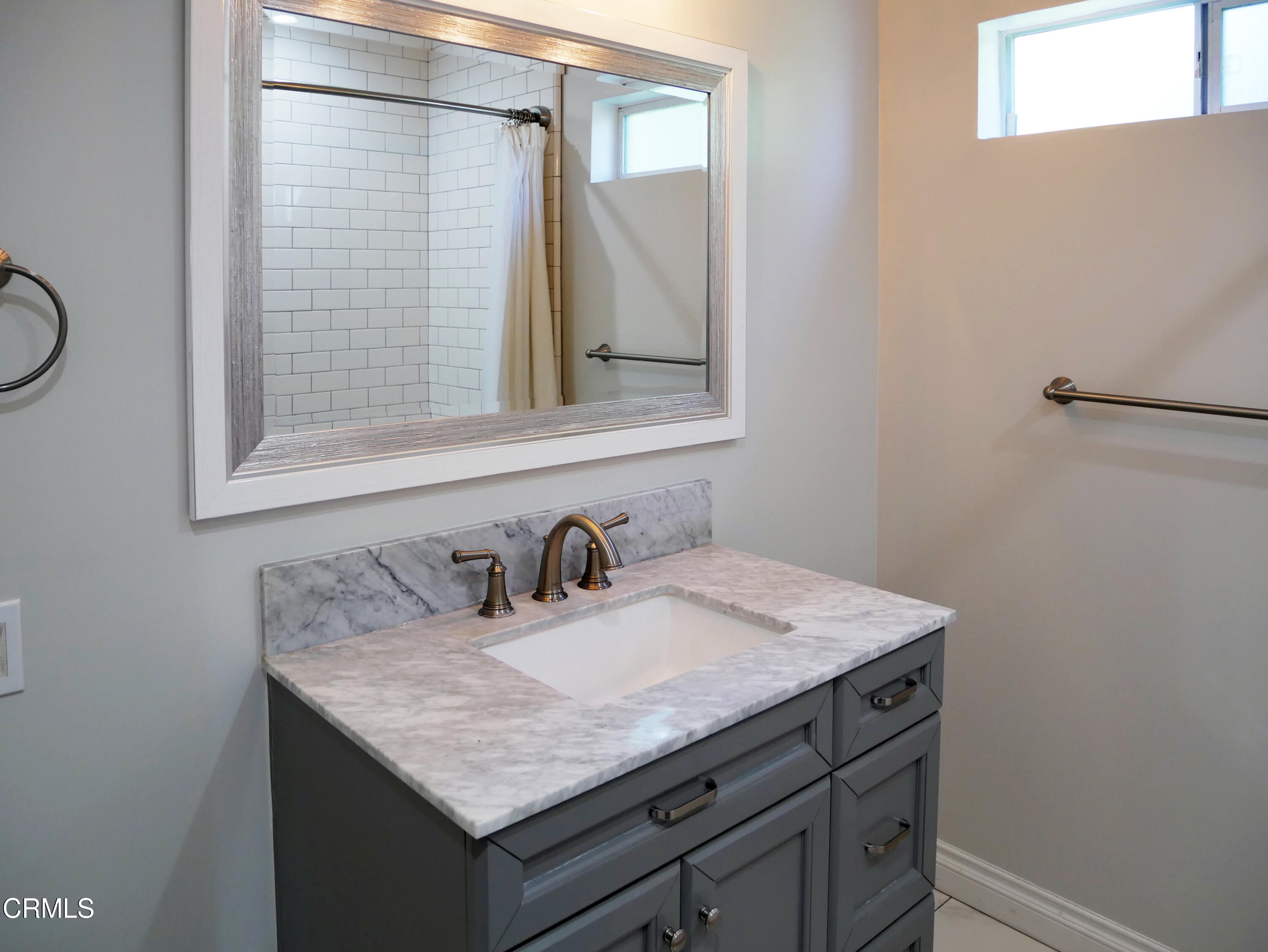 923 Morada Place Altadena, CA 91001 - Photo 6 of 19 a bathroom with a granite countertop sink and a mirror