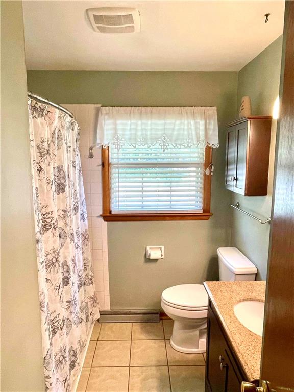 2515 Warren Road Indiana, PA 15701 - Photo 9 of 25 a bathroom with a toilet a sink and a shower