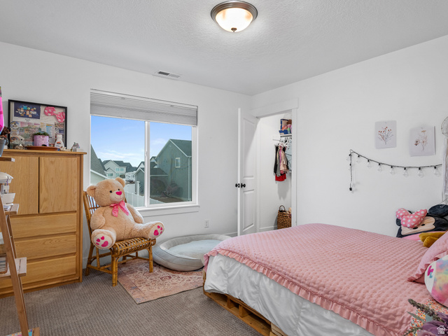 627 South Meade Street Mapleton, UT 84664 - Photo 9 of 48 Bright interior room featuring a window with integrated blinds, providing natural light