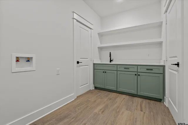 a kitchen with a sink and cabinets