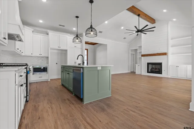 a view of a kitchen with furniture and a fireplace