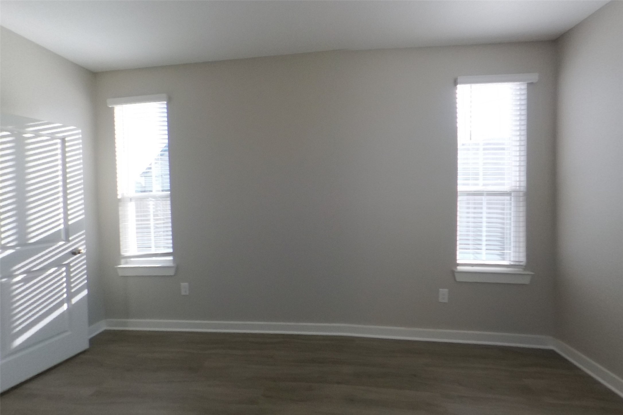 508 Raglands Road Leander, TX 78641 - Photo 7 of 18 Natural light streams through twin windows onto smooth plank flooring in this versatile room.
