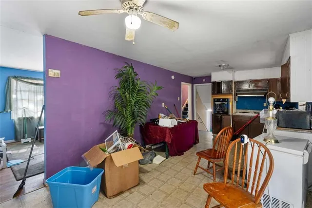 a room with furniture a flat screen tv and a window