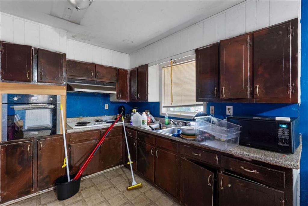 2390 Mellville Avenue Decatur, GA 30032 - Photo 15 of 26 a kitchen with a sink stove and microwave