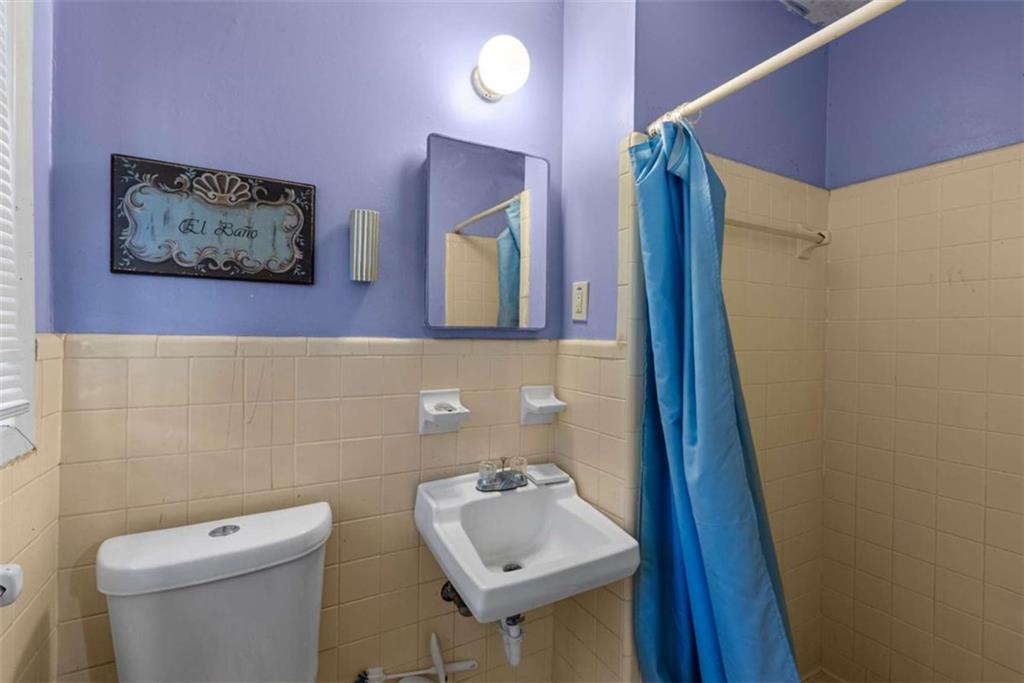 2390 Mellville Avenue Decatur, GA 30032 - Photo 19 of 26 a bathroom with a toilet sink and mirror