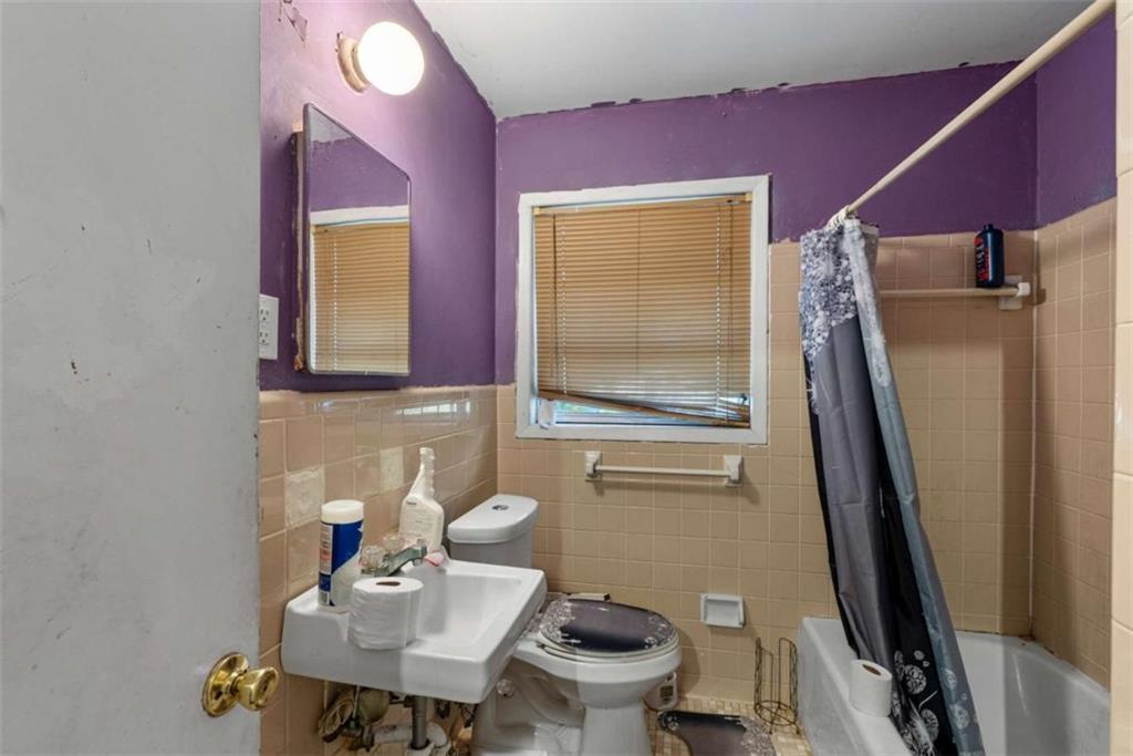 2390 Mellville Avenue Decatur, GA 30032 - Photo 20 of 26 a bathroom with a sink toilet and shower