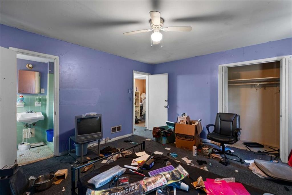 2390 Mellville Avenue Decatur, GA 30032 - Photo 25 of 26 a room with gym equipment and a flat screen tv