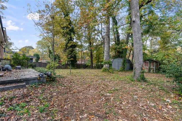 a backyard of a house with lots of green space
