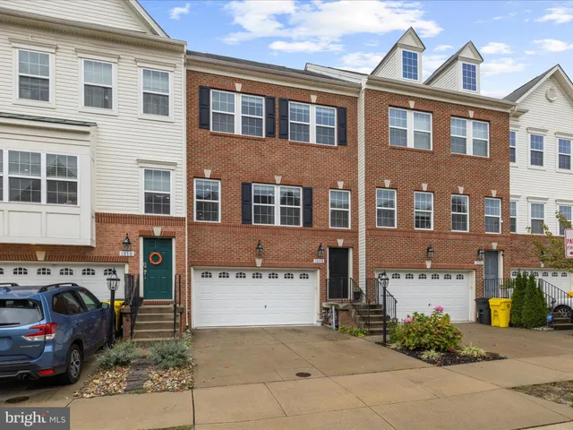 a front view of a building with many windows