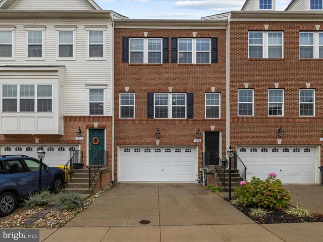 a front view of a building with garden