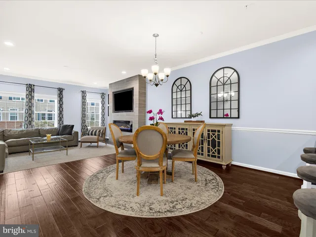 a view of a livingroom with furniture window and wooden floor