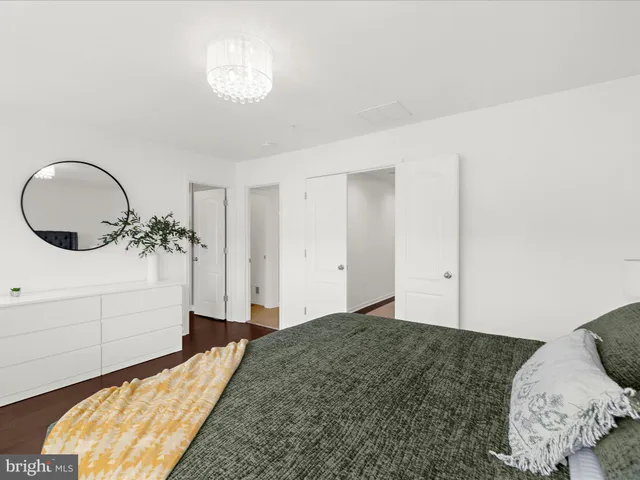 a bedroom with bed and a window