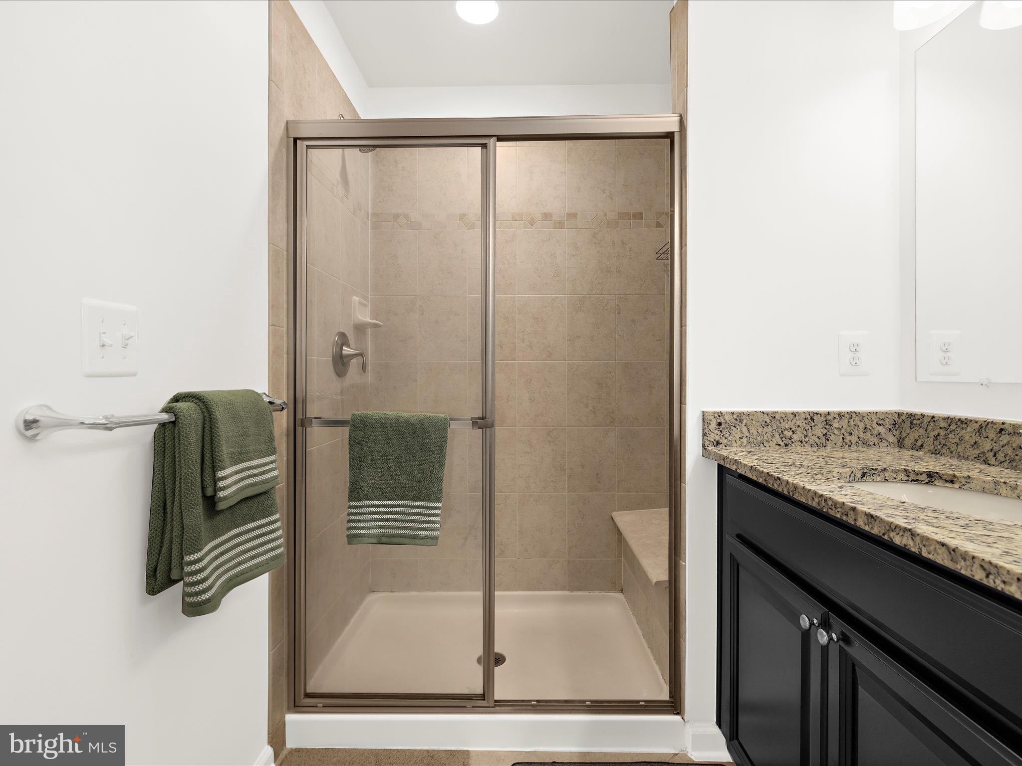 1008 Red Clover Road Gambrills, MD 21054 - Photo 28 of 51 a bathroom with a granite countertop shower a mirror and a sink