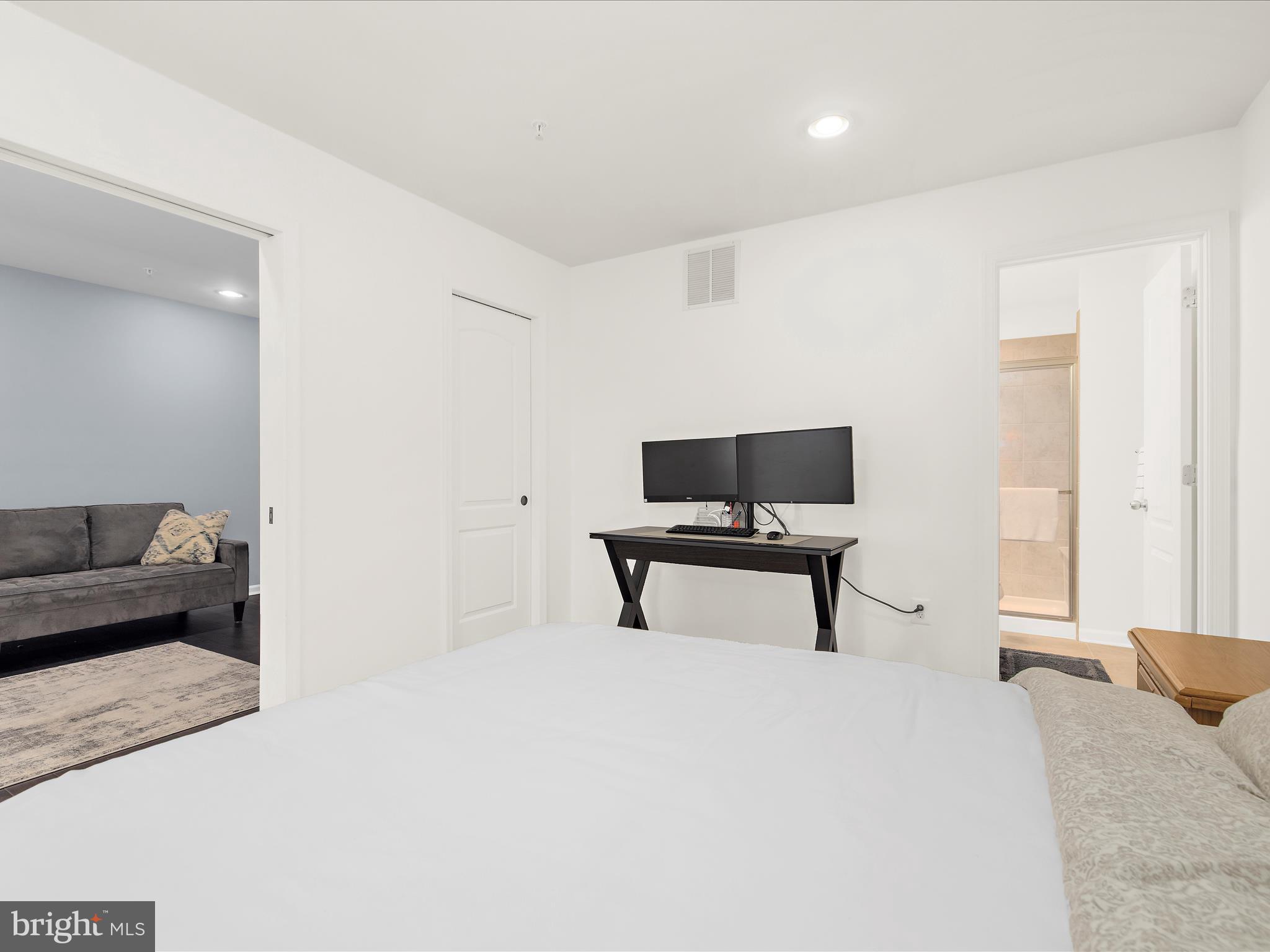 1008 Red Clover Road Gambrills, MD 21054 - Photo 32 of 51 a bedroom with a bed a chair and a potted plant on dresser