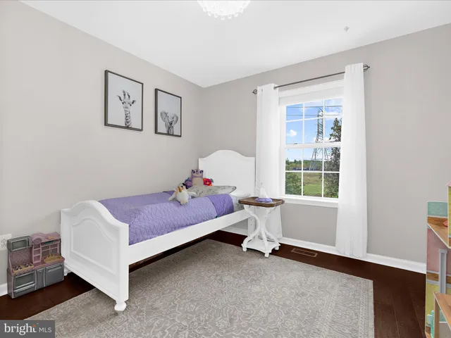 a bedroom with a bed and closet