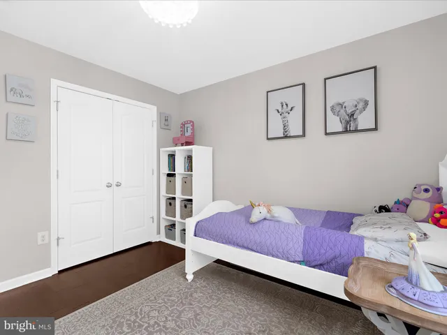 a living room with a bed and a window