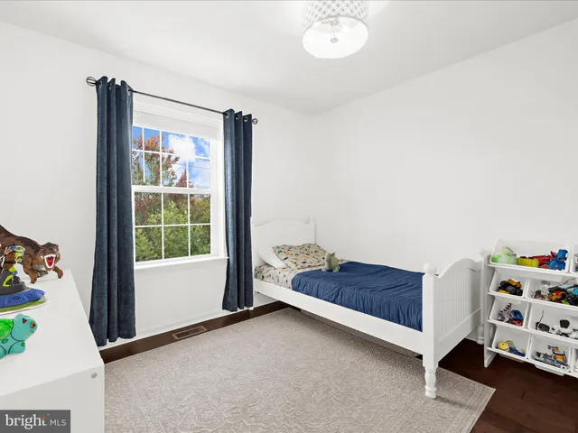 a bedroom with a bed and a closet