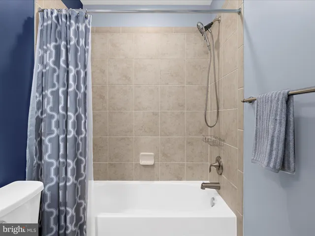 a view of a hallway with washer and dryer